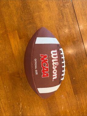 Wilson Brown Football with White Stripes and Red Logo